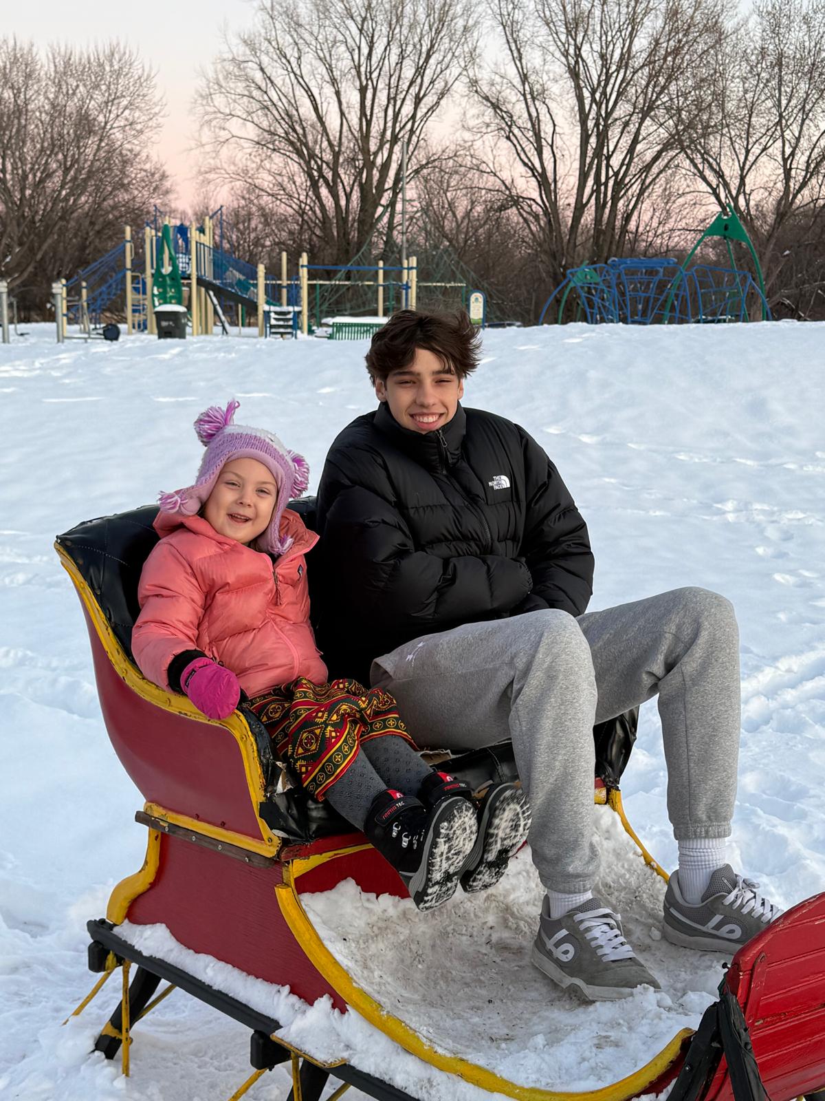 Eduardo and Coraline in sleigh