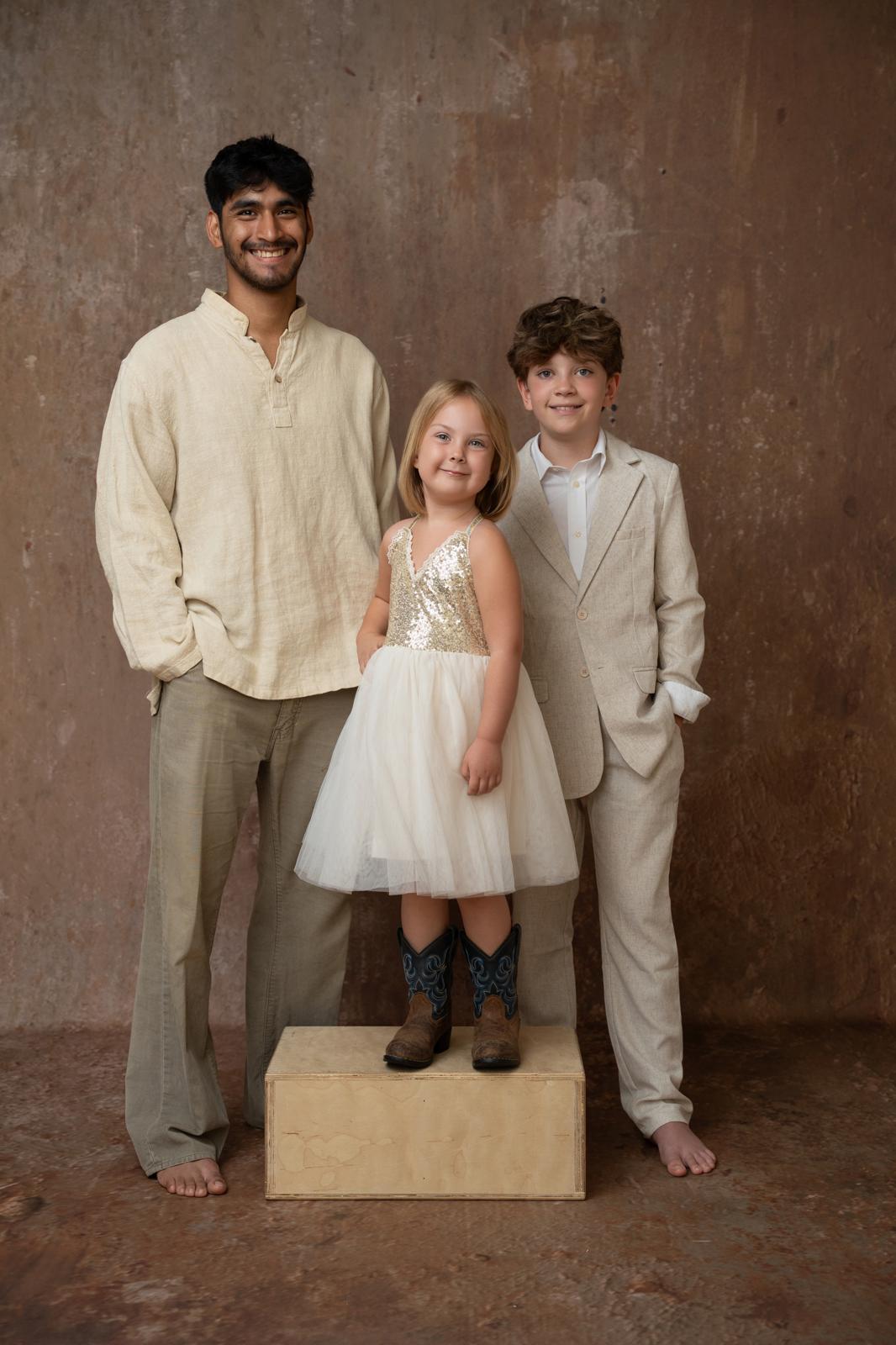 Rigo, Coraline, and Samuel standing together